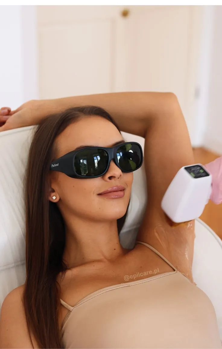 Woman receiving laser hair reduction on her underarm