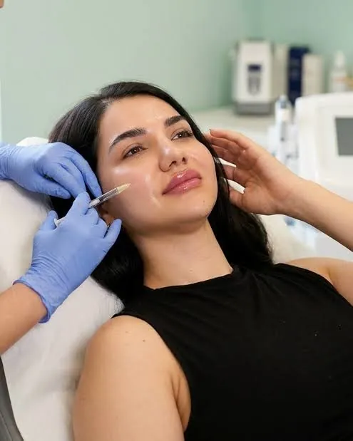 Woman receiving a skin booster injection